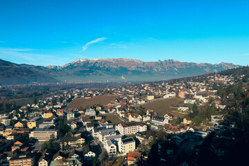 Panoramic view of Vaduz showcasing the city and surrounding mountains on a clear day