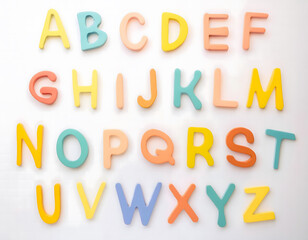 Fototapeta premium Wooden Colorful Letters, English Alphabet on White Background