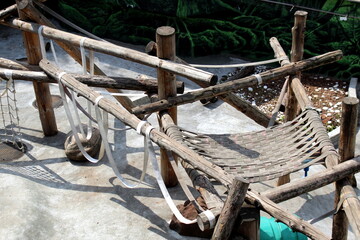 Empty monkey enclosure in summer with ropes and logs. ©  DENIS  