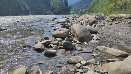 mountain river with stones and fast current