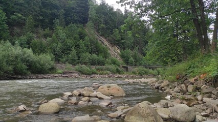 mountain river with stones and fast current