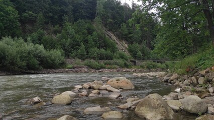 mountain river with stones and fast current