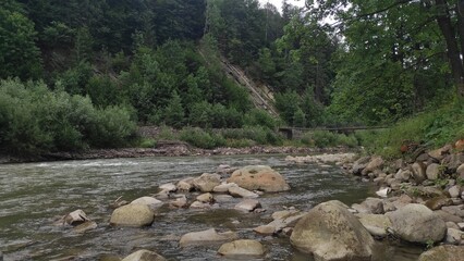 mountain river with stones and fast current