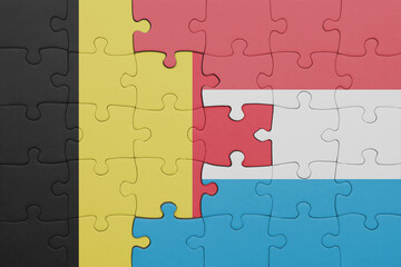 puzzle with the colourful national flag of luxembourg and flag of belgium.