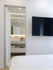 Fototapeta premium Modern Bedroom with Ensuite Bathroom and Sleek, Minimalist Design