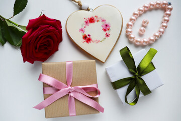 gift concept. beautiful gift boxes with bows and a bouquet of red roses