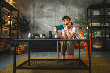 Mature japanese woman watch movie, series on mobile phone at home