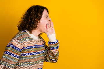 Photo of crazy bossy guy with wavy hairdo dressed ornament sweater scream to empty space arm on...