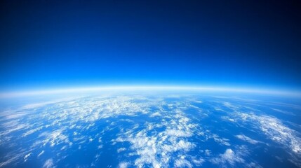 Fototapeta premium Aerial Perspective A Blue Canvas of Clouds Swirling White Against a Deep Azure Sky Captured from Above