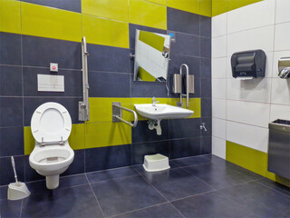 Public disabled toilet. Handrails for people with disabilities
