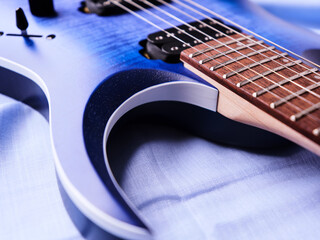 Fretboard of modern electric guitar. Close up.