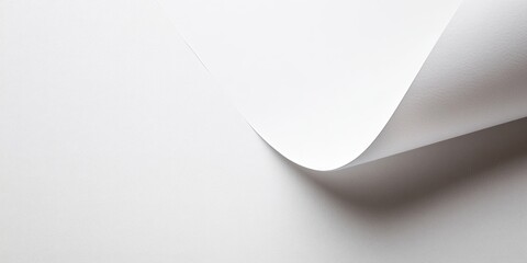 Curved White Paper: A minimalist abstract image featuring a crisp white paper sheet with a subtle curve, offering a clean and modern aesthetic.  