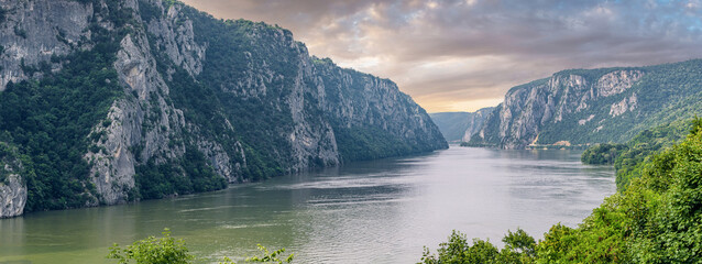 Scenic view of the Iron Gate Gorge on the Danube River, showcasing the dramatic landscape and natural beauty along the Serbia-Romania border