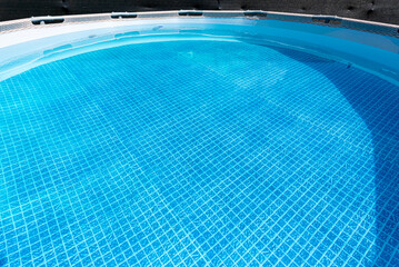 Large expansion pool with a diameter of 3.96 m, located in the yard on the grass.