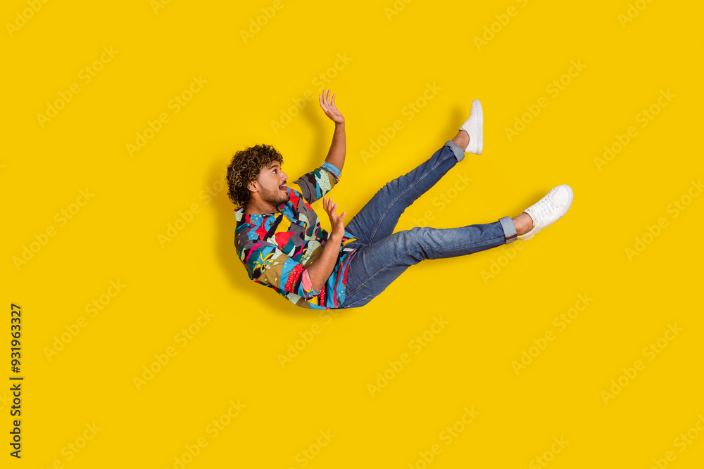 Sticker full size photo of pretty young guy falling down fly wear trendy colorful outfit isolated on yellow 