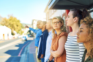 Outdoor, station and waiting for bus, people and row for travel in morning, serious and New York. City, group and queue to commute in line, together and thinking for late public transport of USA