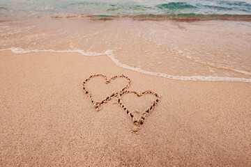 The inscription I love you on the seashore with palm trees