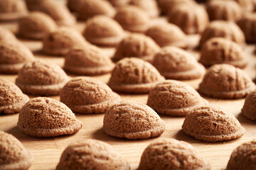 Baked homemade Christmas cookies in the form of nuts on a wooden table