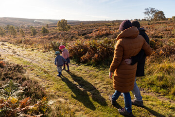 Happy family walking in the countryside
