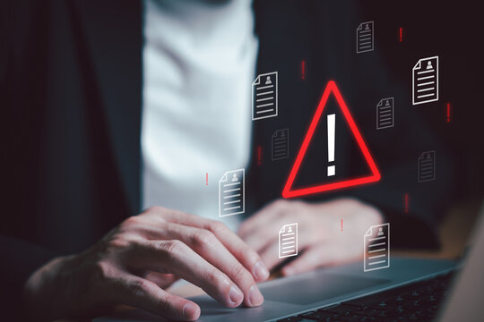 Close up shot of people point to access to personal data and document with warning sign as concept of data breach or attack from hacker or spyware. Data security concept.