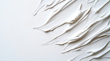Obraz premium A close-up of textured white paint swirls on a canvas, showcasing creative strokes and smooth finishes for artistic inspiration.