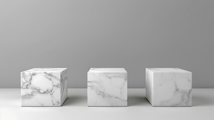Three White Marble Cubes on a White Surface