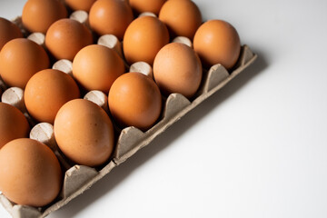 Chicken eggs in a paper tray top view
