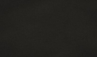 Subtle pattern created by grainy texture on dark grey background