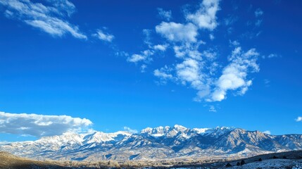 Snow-Capped Mountains Under a Blue Sky