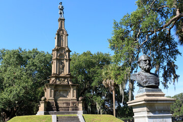 Close up of statue of Lafayette McLaws with civil war confederate monument in background in Savannah, Georgia, USA