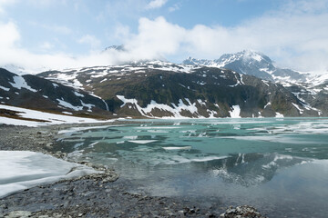 Icy lake on the mountains of Lyngen Alps in Norway.
