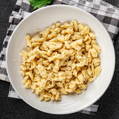 spaetzle egg pasta irregular shape fresh meal food snack on the table copy space food background rustic top view