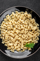 spaetzle egg pasta irregular shape fresh meal food snack on the table copy space food background rustic top view