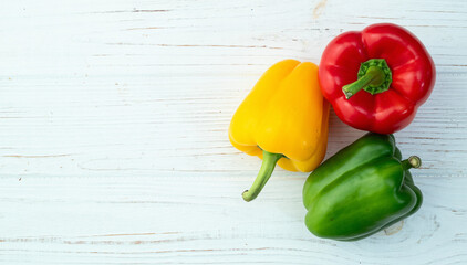 Fresh sweet bell pepper ( paprika ) photography red , green and yellow . Colorful vegetable . Top...