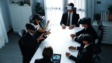 Top view of manager working on laptop and sending data analysis to business people by using VR glass headset while diverse team planning marketing strategy and looking at financial graph. Directorate.