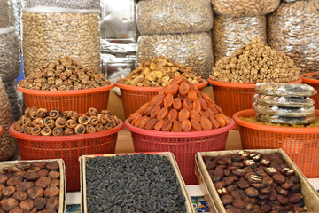 Nuts, dried fruit and grainfill the shelves at a traditional bazaar in the Silk Road city of Samarkand