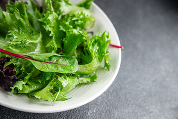 salad green leaves mix salad fresh meal food snack on the table copy space food background rustic top view keto or paleo diet vegetarian vegan food