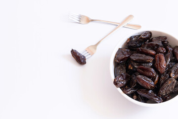 White bowl with portion of dates