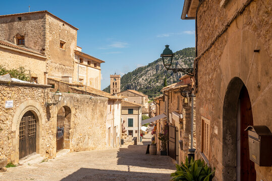 Traditional stone buildings in an Empty street in the old town, Pollensa (Pollenca), Majorca, Balearic Islands, Spain