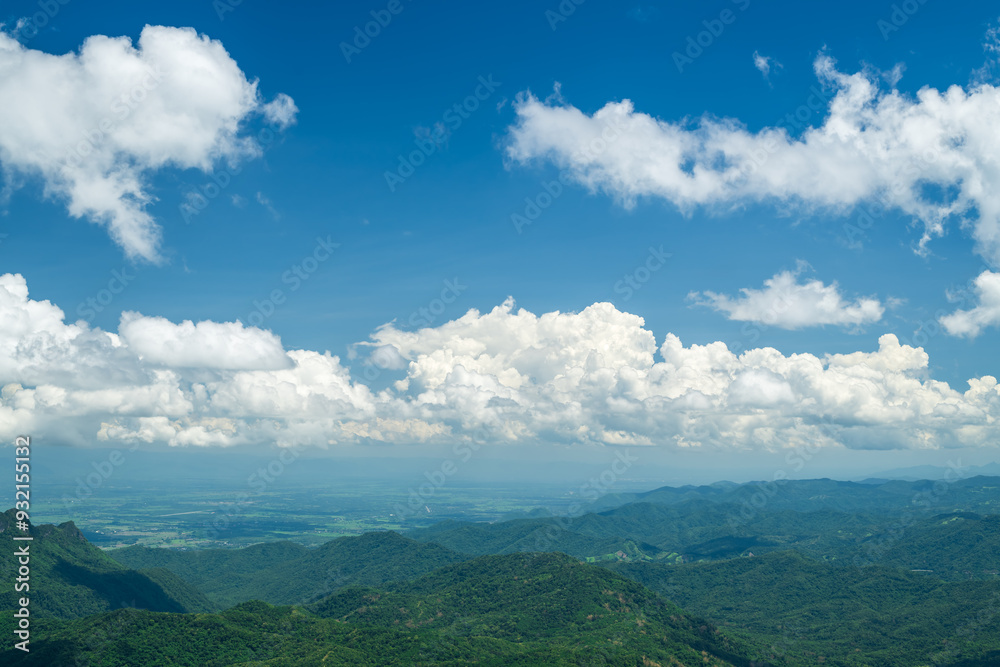Wall mural beautiful white clouds and blue sky with beautiful natural landscape of mountains.