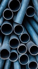 Close-up view of neatly arranged stainless steel pipes in a warehouse, emphasizing their durability and versatility for various industrial applications