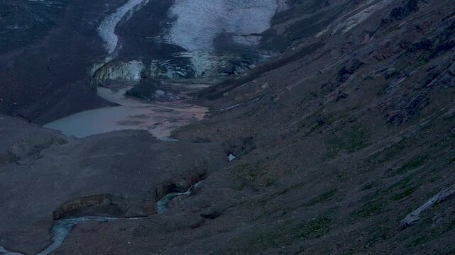 Mesmerising view of  huge Pasterze glacier-size 9 kilometres. Rays of  morning sunshine illuminate  beautiful Grossglockner mountain.  Austria