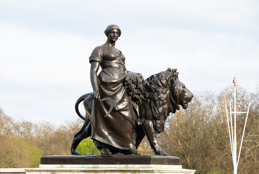 Bronze figure of Agriculture supported by a bronze lion, Victoria Memorial, The Mall, London, England, United Kingdom