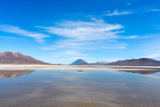 Reflection pool on salt flats and distant views of El Misti and Chachani volcanoes, Salinas y Aguada Blanca National Reserve, Arequipa Province, Arequipa Region, Peru