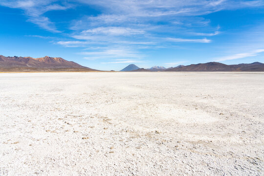 Salt flats and distant views of Pichu Pichu, El Misti and Chachani volcanoes, Salinas y Aguada Blanca National Reserve, Arequipa Province, Arequipa Region, Peru