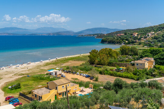 View of beach at Paralia Kalamaki and Albanian coast in background, Paralia Kalamaki, Corfu, Ionian Sea, Greek Islands, Greece