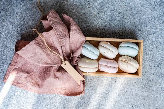 Overhead view of a box of assorted Zefir confectionery on a table with a blank gift tag