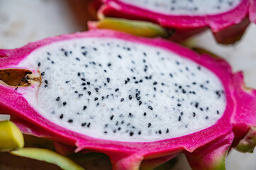 Pitaya or dragon fruit, cut on a marble surface