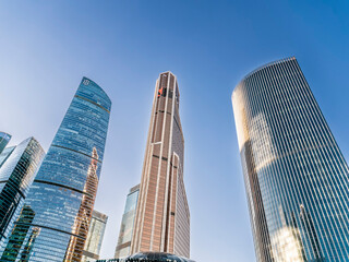 Fototapeta premium Modern HighRise Architecture That Effectively Reflects the Urban Cityscape Aesthetics