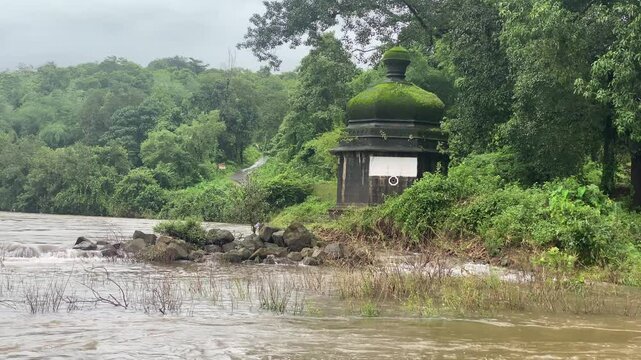 river waters near the temple at sangameshwar in Konkan, Maharashtra swell during the monsoon season